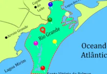 Explorando a Geografia do Município de Rio Grande – RS Mapa geográfico do município de Rio Grande. O municípios está destacado em verde com alguns alfinetes coloridos cravados. O oceano azul e o restante do mapa amarelo.