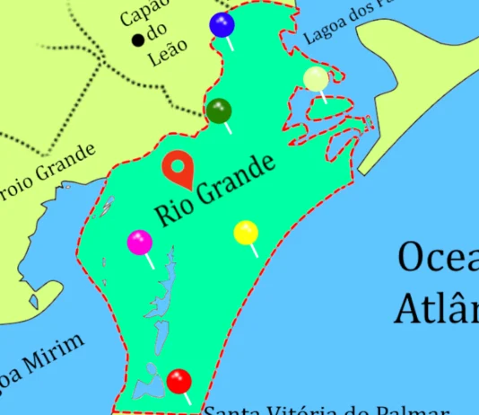 Explorando a Geografia do Município de Rio Grande – RS Mapa geográfico do município de Rio Grande. O municípios está destacado em verde com alguns alfinetes coloridos cravados. O oceano azul e o restante do mapa amarelo.